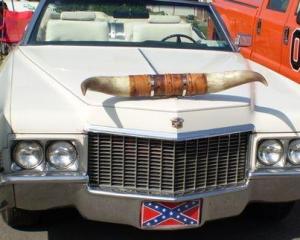 A true texans with a horned adorned cadillac
